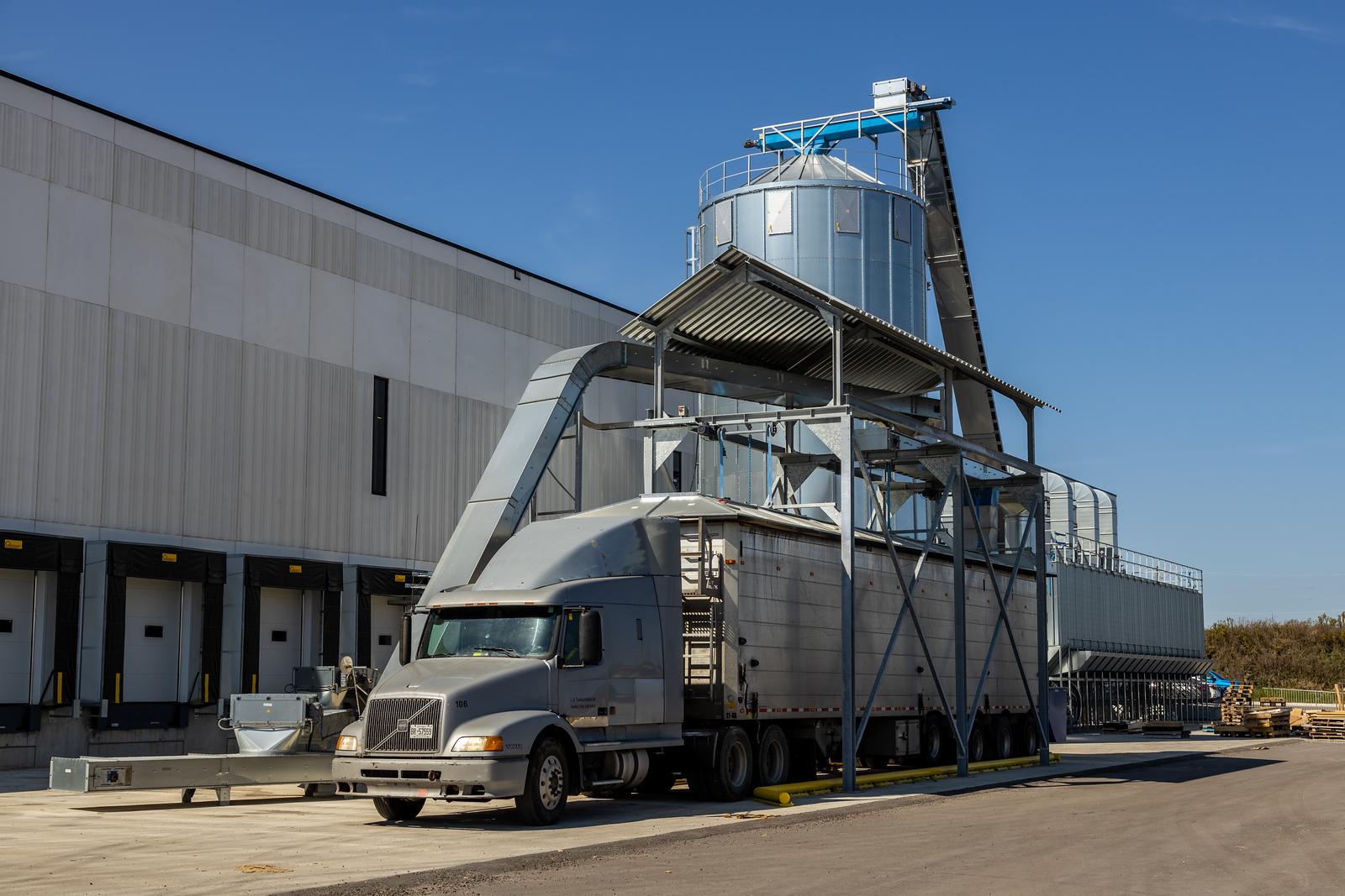 Truck on a loading dock to capture raw milled materials